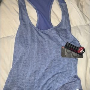 2 women’s work out tanks new with tags!
